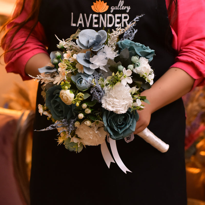 Turquoise roses .White carnation.Turquoise orchid 
Blue. White lavender.Small peony  and White leaves 