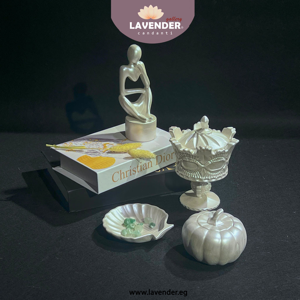 Decorative items including a sculpture, book, and decorative pieces 