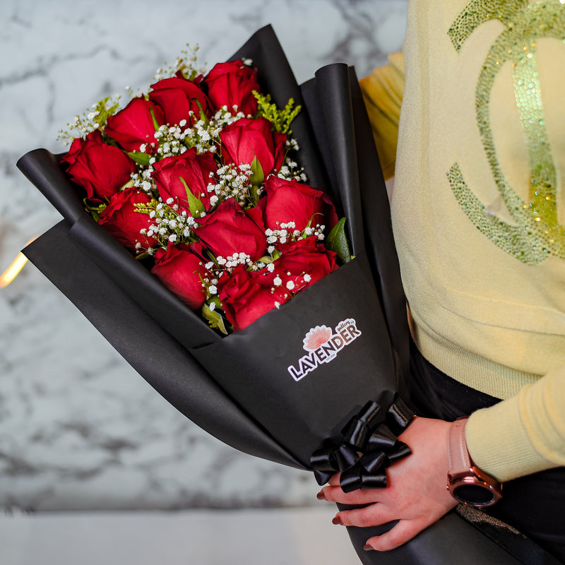red roses .white gypsophila and green leaves