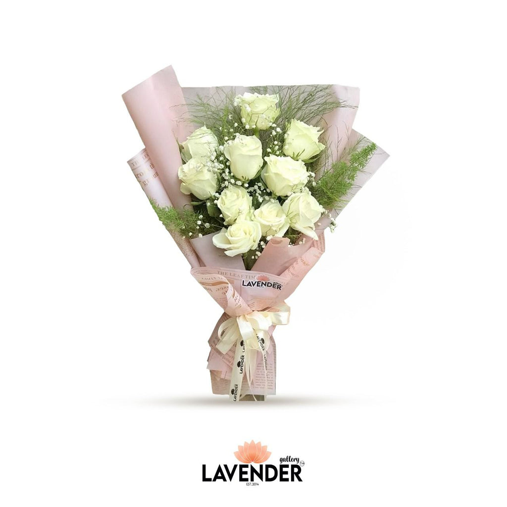 natural white roses in pink wrap 