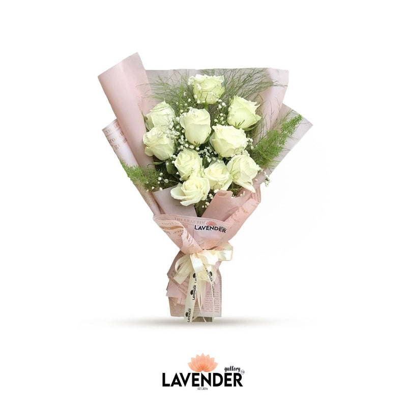 natural white roses in pink wrap 