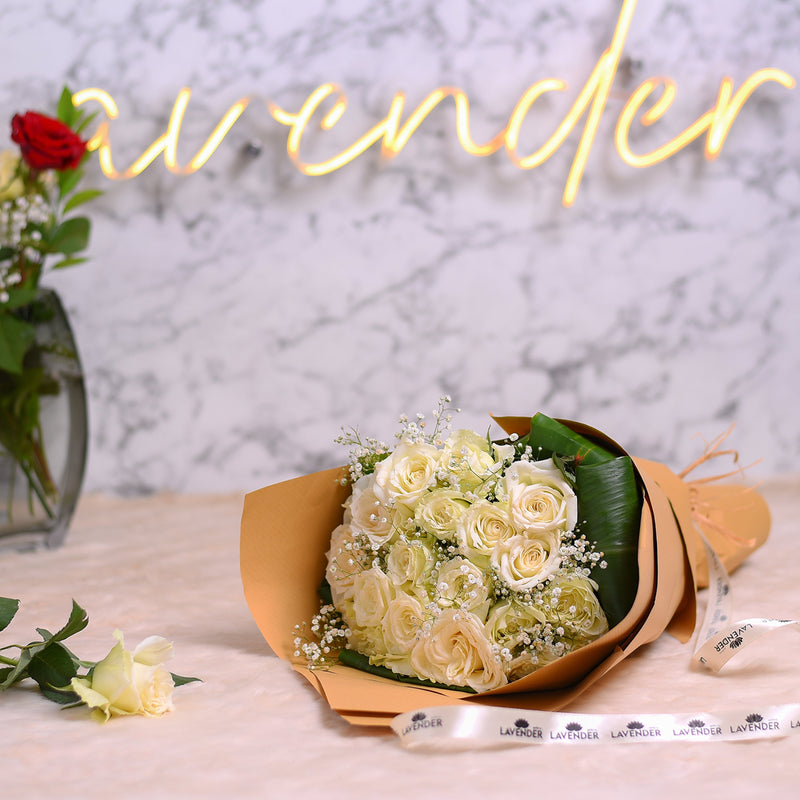 White roses .white gypsophila and green leaves