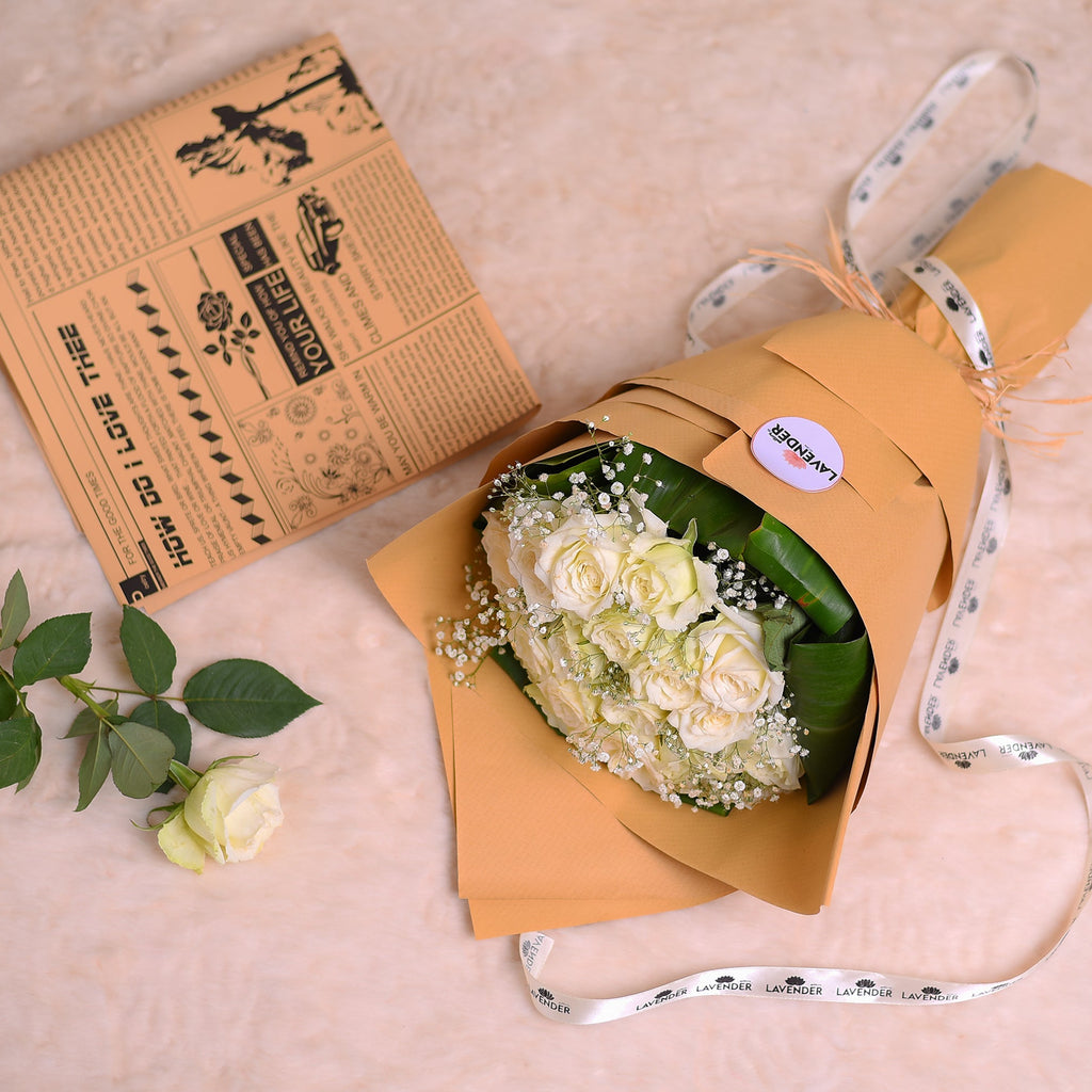 White roses .white gypsophila and green leaves