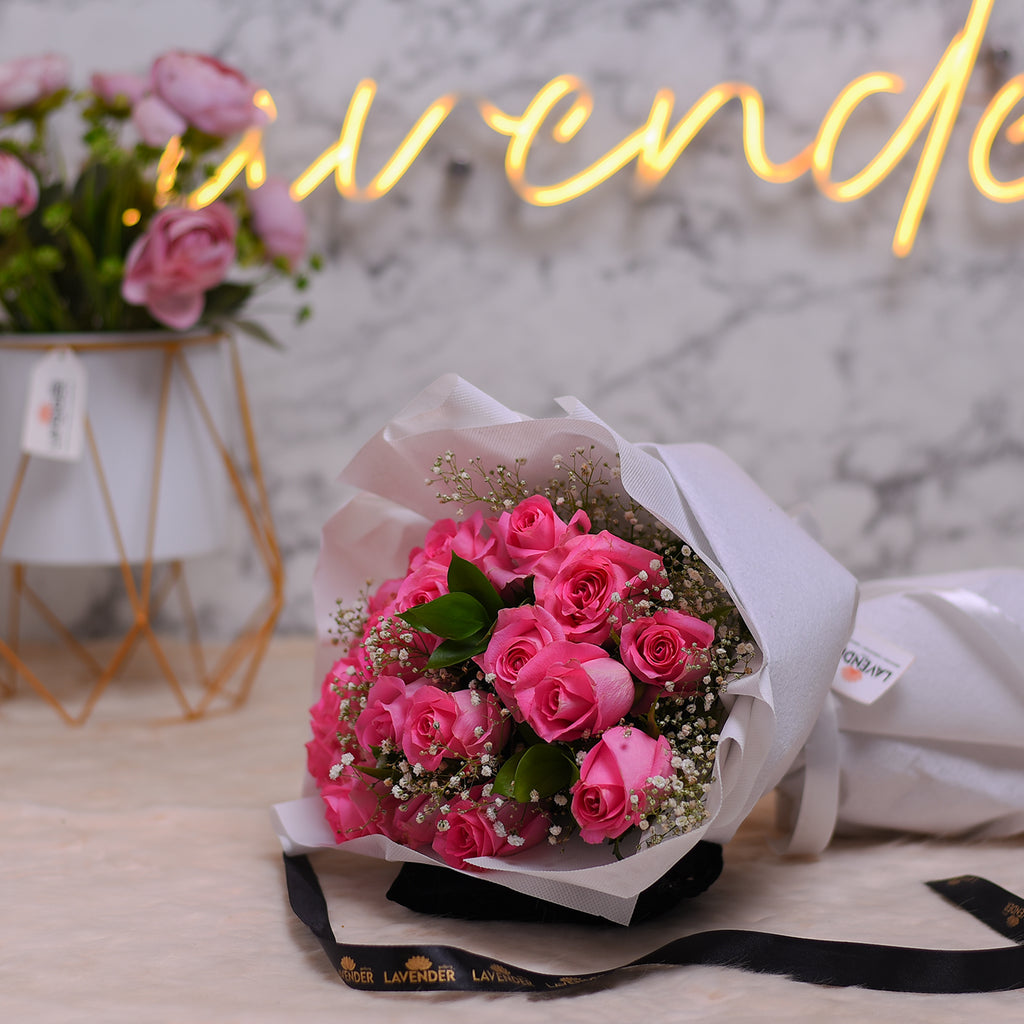 pink roses .white gypsophila and green leaves