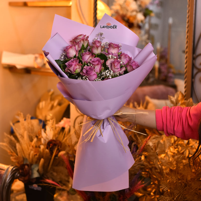 lavender roses .white gypsophila and green leaves