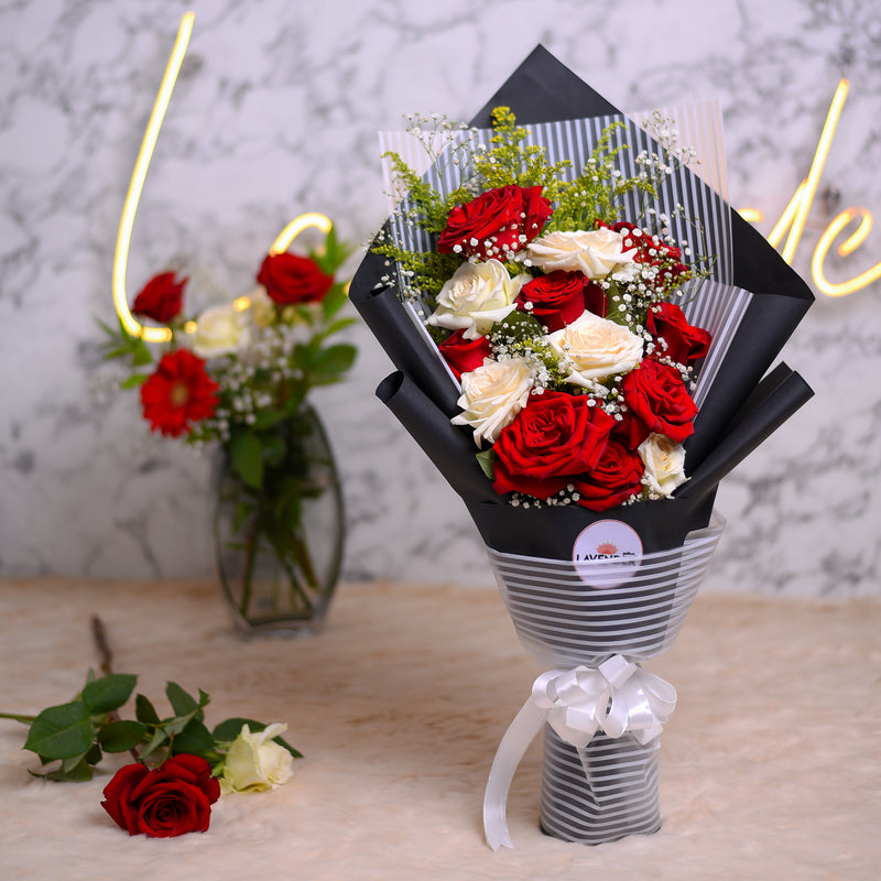 red and white roses .white gypsophila and green leaves