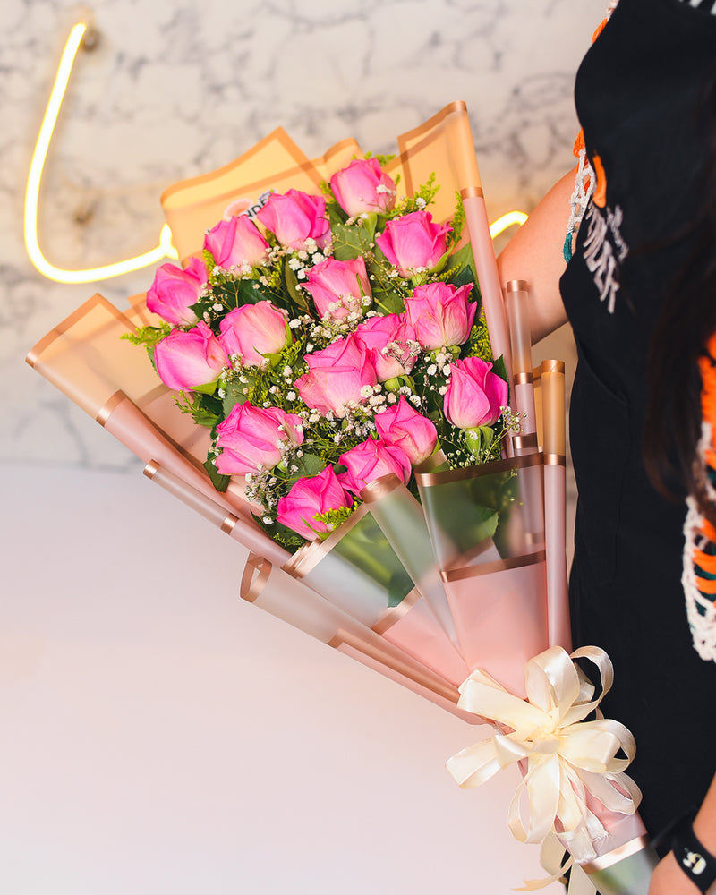 Pink roses .white gypsophila and green leaves
