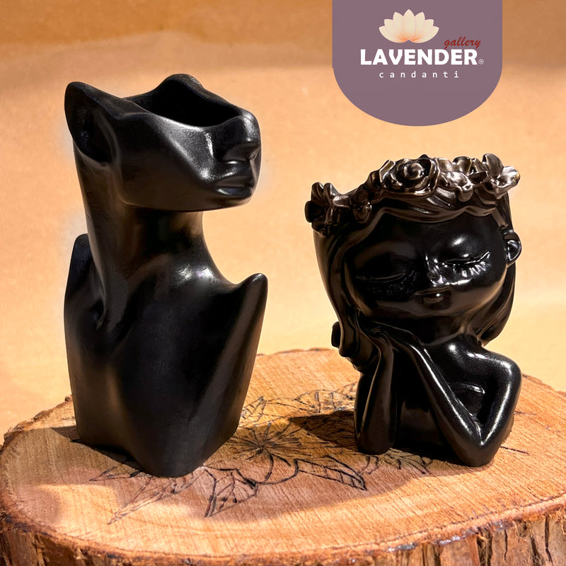 Two black ceramic sculptures 